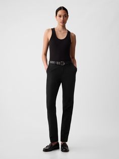 Soft cotton-spandex pants with two-way stretch.  Concealed hook and bar closure.  Zip fly.  Front slant pockets.  Back welt pockets.  Mid rise.  Sleek and straight with a slim fit.  Hits at the ankle.  Model is approx.  5’10” wearing