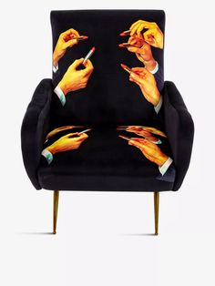 a black chair with hands on it and two fingers pointing at the same person's finger