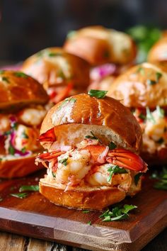 shrimp sandwiches on a wooden cutting board with parsley sprinkled around the edges