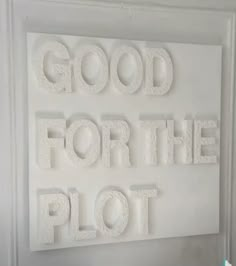 the words good for the plot are made out of foam and white letters on a wall