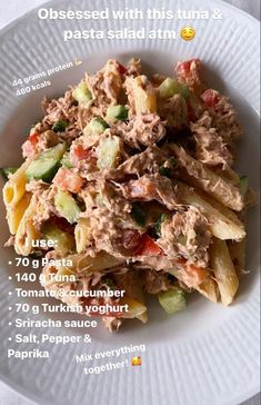 a white plate topped with pasta covered in meat and veggies next to an instagram