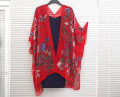 "This versatile kimono cardigan can be worn as a beach cover-up or with a  dress or camisole. Suitable for daywear or eveningwear, the perfect addition to any wardrobe.  Ideal for holidays and travelling, even backpacking as it takes up nearly no room in your travel bag and is light. - Pink Kimono Cardigan  - Wide Sleeves - Draping perfectly - Light weight sheer soft fabric - One size fits most - Floaty fabric - Light and breathable - V neck style at the back *Please note the dress is not includ Red Kimono For The Beach, Red Floral Print Kimono For The Beach, Red One-size Kimono For Spring, Red Kimono With Kimono Sleeves For Beach Cover-up, Red Kimono With Kimono Sleeves For Beach, Red Wrap Kimono For Beach, Spring Vacation Shawl Kimono, Red One-size Summer Kimono, Summer Red Free Size Kimono