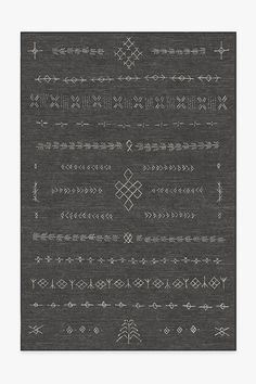 a black and white rug with different designs on it