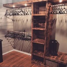 a wooden shelf filled with shoes next to a wall mounted coat rack and shoe rack