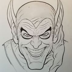 a drawing of a demon with horns and fangs on it's face is shown