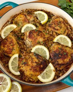 chicken and rice with lemons in a skillet