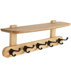 a wooden coat rack with three hooks on it