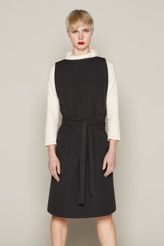 The elegant Isabelle wrap dress is crafted from 100% certified organic cotton. The fabric has a luxurious, soft feel to it and is cut to a beautiful, contemporary shape. It features a long sash belt that brings the waist in, which, along with the subtle A-line shape through the skirt, creates a flattering silhouette.The dress is available in two colours: beige and black. Both are incredibly versatile but look perfect when layered over a plain, long-sleeved cotton top. The dress is finished with Chic Fitted Cotton Belted Dress, Chic Cotton Dress With Tie Waist, Cotton Dress With Belted Cuffs For Fall, Chic Cotton Wrap Dress, Midi Length, Cotton Workwear Dresses With Tie Fastening, Cotton Dresses With Tie Fastening For Work, Chic Belted A-line Wrap Dress, Cotton Dress With Tie Fastening For Work, Fitted Cotton Belted Dress For Work