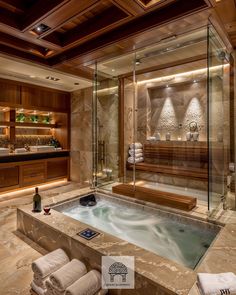 a bathroom with a large jacuzzi tub and wooden cabinets