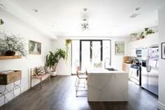 the kitchen is clean and ready to be used as a living room or dining area