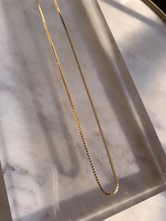 "* 24k gold filled dainty box chain layering accent piece, or wear solo * Available in 16\" and 18\" lengths * Pair with the Box Chain Bracelet to wear the matching set * Handmade in SB, California * Expected shipping 4-7 business days" Everyday Gold Plated Box Chain Necklace, Gold Rectangular Curb Chain Necklace, Delicate Box Chain Necklace For Everyday, Gold Minimalist Necklace With Curb Chain, Minimalist Gold Necklace With Curb Chain, Gold 14k Gold-filled Box Chain Necklace, 14k Gold Filled Box Chain Necklace, 14k Gold-filled Yellow Gold Box Chain Necklace, 14k Gold Filled Yellow Gold Box Chain Necklace