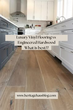 a kitchen with white cabinets and wood flooring that is being featured in the article luxury vinyl floors