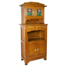 a wooden cabinet with glass doors and drawers