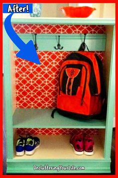 an orange backpack sitting on top of a green shelf next to shoes and a bowl