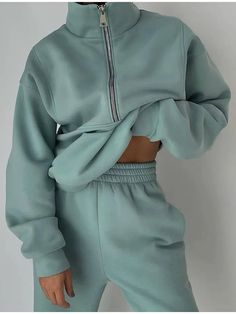 A teal gray sweatsuit with matching sweatshirt and sweatpants are worn by a woman who is holding up the top to expose her midriff  - Fleece Chic Leisure Suit, Sweatshirt Zipper, Half Zip Sweatshirt, Estilo Chic, Fleece Sweatpants, Sweatpants Set, Women Sleeve, Women Set, Outfit Casual