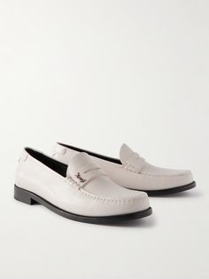 SAINT LAURENT's penny loafers stay true to the classic styles that inspired them. Crafted from supple leather, they have low-block heels and are appliquéd with the maison's unmistakable interlocking moniker. Mens White Loafers, White Dress Shoes Men, Saint Laurent Collection, Penny Loafers Men, White Loafers, Loafers For Men, White Dress Shoes, Ysl Heels, Saint Laurent Shoes