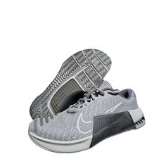 Elevate Your Crossfit Training With These Nike Metcon 9 Athletic Sneakers. Designed For Men, These Shoes Have A Low Top Shoe Shaft Style And A Comfortable Standard Shoe Width. The Multi-Color Solid Pattern And Wolf Gray Character Give Them A Stylish Look. They Feature Cushioning, Arch Support, And Are Made With Breathable Mesh Upper Material. The Nike Free Metcon Model Is Perfect For Any Sports-Themed Activity, And The Shoes Come In Men's Size 10 With A Uk Size Of 9 And Eu Size Of 44. They're Ma Nike Gray Sneakers For Gym, Nike Free Metcon, Crossfit Training, Mens Training Shoes, Nike Metcon, Athletic Sneakers, Training Shoes, Solid Pattern, Top Shoes