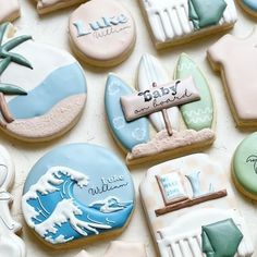 some decorated cookies are laying on a table