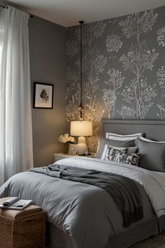 a bedroom with gray walls and white curtains