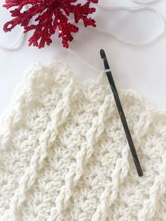 the crochet pattern is being worked on with yarn