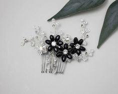 Three black crystal bead flowers are the centerpiece of this wedding decorative hair comb. Handmade in silver the flowers are surrounded by sprays of crystal beads and black diamond color stones. This bridal comb measures about 4.5 inches long and 3 inches high. Black Bridal Hair Accessories, Black Flower Shaped Wedding Jewelry, Black Flower Hair Piece, Mother Of The Bride Hair Black Crystal Hair Comb, Crystal Hair Comb Wedding, Headpiece Hairstyles