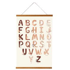 a poster hanging on the wall with letters and numbers in different colors, shapes and sizes