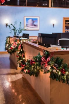 christmas garland on the front desk of a dental office