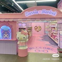 the hello kitty store is pink and has hello kitty decorations on it's walls