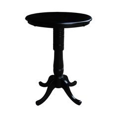 a small black table sitting on top of a white floor