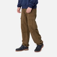 Color: Chocolate - The Regular Cargo Pant is made of midweight cotton Columbia ripstop, which has been rinsed for a softer feel. The style is cut in a regular fit with a low waist and features double-layer knees, adding to its robust qualities. Multiple pockets throughout nod to the garment's military-style influences, and tie detailing at the cuffs allow for the fit to be adjusted. The Aviation Pant () offers the same lightweight quality construction with a slimmer fit. _* Columbia ripstop: 100 Color Chocolate, Cargo Pant, Military Style, Carhartt Wip, Low Waist, Military Fashion, Double Layer, Low Rise, Columbia