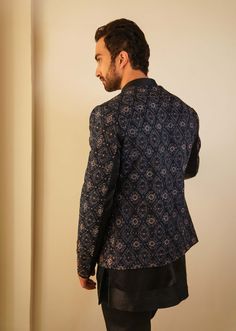 Editor's Note Featuring Our Bestseller Short Jacket, Now In A Midnight Blue Color. After Being A Hero Outfit For Consecutive Two Seasons, We Are Now Showcasing The Jamawar Embroidered Short Jacket With Dabka Highlighting, In Our New Color. Paired With Short Embroidered Hem Kurta With Tapered Trousers. Fabric: Linen Silk Color: Blue Component: Short Jacket, Kurta. Trousers Care: Dry Clean Only About the Designer After establishing himself as the leading couturier in the industry of menswear, Jati Blue Nehru Jacket For Festive Workwear, Festive Blue Nehru Jacket For Work, Festive Blue Nehru Jacket For Workwear, Fitted Nehru Jacket With Long Sleeves For Party, Fitted Long Sleeve Nehru Jacket For Party, Tailored Long Sleeve Bandhgala For Party, Festive Blue Long Sleeve Blazer, Festive Long Sleeve Blue Blazer, Festive Blue Party Outerwear