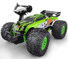 a green monster truck with big tires on a white background