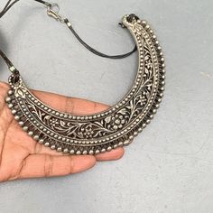 "Bold ~ Beautiful ~ Vintage Torque Necklace most Likely from Nepal or India ~ The necklace is made of mix metal or heavily silver plated ~ Front features a crescent shape disc with lots of details ~ Necklace back has black cord with simple \"J\" hook . Unsigned Tribal beauty . Dates : Mid to late 20th century Measurements : Necklace is approx. 15 inches in length (due to its shape its hard to measure ~ Crescent disc is 5 inches x 2 1/2 inches in total drop length Weighs 79 grams on my weighing s Floral Flower Design, Torque Necklace, Silver Choker Necklace, Detailed Necklace, Crescent Shape, Late 20th Century, Floral Flower, Mixed Metals, Glass Necklace