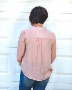 This super detailed Button Up Split Neck Top in Mauve includes long sleeves with smocked elasticized cuffs, split neckline,functional buttons, geometric detail, sheer, but not lined. SO CUTE. Take on all occasions wearing this beautiful top. ABOUT THIS ITEM: Made in Vietnam. Fabric is 62% Rayon / 38% Polyester. Hand wash in cold water. Wash inside out. Hang or line dry. The Model is 5'6, and wearing a large, runs a little small. Flowy Long Sleeve Blouse With Smocked Cuffs, Chic Long Sleeve Smocked Top With Stretch, Chic Stretch Smocked Long Sleeve Top, Flowy Smock Blouse, Casual Long Sleeve Blouse With Smocked Cuffs, Feminine Smocked Top With Blouson Long Sleeves, Bohemian Blouse With Smocked Back And Long Sleeves, Bohemian Long Sleeve Blouse With Smocked Back, Flowy Long Sleeve Blouse With Smocked Back