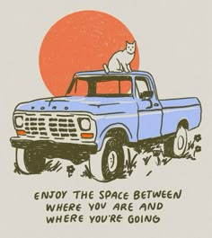 an orange and blue truck with a cat on the top, says enjoy the space between where you are and where you're going