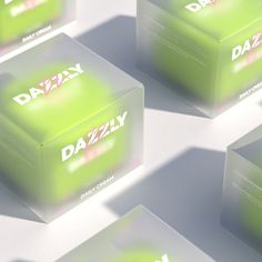 several green boxes with the word daizy printed on them are shown in close up