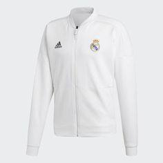 Real Madrid adidas Z.N.E. Jacket A Real Madrid jacket with relaxation built in. The adidas Z.N.E. collection was designed to keep athletes comfortable in the moments before competition. This Real Madrid anthem jacket is made of smooth fabric with a wide fit in the body. It's identical to the ones players wear as they emerge from the tunnel and step into the spotlight. Be ready in an instant A quick-release zip lets you tear the jacket off at a moment's notice Club details It features an embroide White Adidas Logo Functional Track Jacket, White Adidas Functional Track Jacket, White Functional Adidas Track Jacket, White Adidas Logo Functional Outerwear, White Adidas Functional Outerwear, White Functional Adidas Outerwear, Functional White Adidas Outerwear, White Long Sleeve Track Jacket With Adidas Logo, White Long Sleeve Adidas Track Jacket