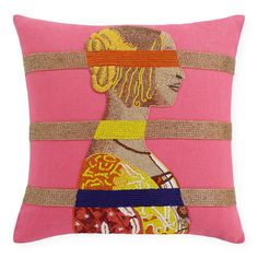 a pink pillow with an image of a woman's head on the front and sides