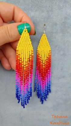 These handmade unique earrings are made of high-quality Czech beads and strong synthetic thread. I use my author's scheme. They are elegant, fashionable, and highly versatile, suitable for everyday wear. There may be some color discrepancies which is due to the different monitor settings. 100% hand made with love! Measurements: Length-about 12cm (4.72 inch) Width -about 2 cm (0.8 inch) Materials: Sterling silver components Czech glass beads Strong bead weaving thread Handmade Rainbow Beaded Dangle Earrings, Rainbow Dangle Beaded Earrings Handmade, Colorful Handmade Dangle Tassel Earrings, Rainbow Handmade Beaded Dangle Earrings, Multicolor Beaded Tassel Dangle Earrings, Handmade Multicolor Tassel Earrings With Round Beads, Multicolor Handmade Tassel Earrings With Round Beads, Handmade Multicolor Dangle Tassel Earrings, Handmade Multicolor Tassel Drop Earrings