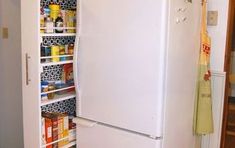 a white refrigerator freezer sitting inside of a kitchen