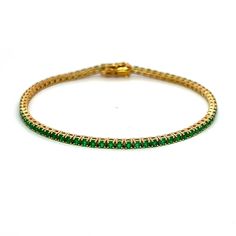 Exquisite and perfectly blended tsavorite garnet tennis bracelet, by Alexander Beverly Hills. 75 round tsavorite garnets, 2.45 carats total. Four prong set in 18-karat yellow gold, 7.75 grams, 7 inches. Accommodated with an up-to-date digital appraisal by a GIA G.G. once purchased, upon request. Please contact us with any questions. Classic Green Round Diamond Bracelet, Round Emerald Tennis Bracelet As Gift, Round Emerald Tennis Bracelet Gift, Emerald Tennis Bracelet Gift, Luxury Green Round Tennis Bracelet, Classic Green Round Tennis Bracelet, Green Gemstone Diamond Bracelet, Green Round Tennis Bracelet With Prong Setting, Green Tennis Bracelet With Prong Setting