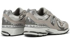 The BAPE x New Balance 2002R ’Grey Camo’ is a part of the larger ‘Apes Together Strong’ collection. The lifestyle running shoe is treated to a neutral makeover, with various shades of grey applied to the textile upper. It's covered in BAPE's ABC camo print and reinforced with tonal suede overlays. Silver reflective detailing on the ‘N’ logo and wraparound shark tooth detailing offers added visibility in low-light conditions. Lightweight cushioning is provided by an off-white ABZORB midsole, supp New Balance 2002r Grey, Apes Together Strong, Bape Ape, New Balance 2002, New Balance 2002r, Grey Camo, Japanese Streetwear, Retro Modern, Tan Suede