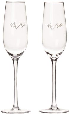 two wine glasses with the word mr and mrs written on one glass, set against a white background