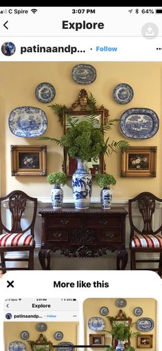 an image of a dining room with blue and white plates on the wall above it