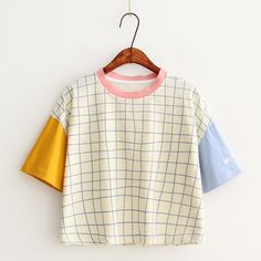 Trendy Cotton Patchwork T-shirt, Spring Cotton Patchwork T-shirt, Yellow Patchwork T-shirt For Spring, Trendy Cotton Color Block Shirt, Trendy Color Block Cotton Shirt, White Color Block T-shirt For Spring, Spring White Color Block T-shirt, Cute White Patchwork Top, Yellow Patchwork Crew Neck Top