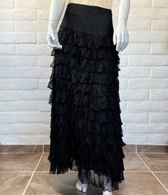 This is an AMAZING early design (very late 90s or early 00s) from Marrika Nakk, known for her romantic Western wear fashions. The skirt is constructed from cascading black lace ruffles topped with wide fitted waist panel. It's fully lined (just the bottom couple of inches are sheer) and finished with a side zipper. This is a fabulous, versatile piece that could be styled as Western or goth or boho - it would look great so many ways! The label reads Marrika Nakk. Measurements: no tag; this is approx a size medium. The waist measures 30" (meant to fit a bit low) and the seam at the bottom of the waist panel measures 36" (would hit at high or mid hip on most). It's 43" long. Material: no tag; feels like nylon. Condition: freshly hand laundered and in excellent vintage condition. There's a ver Y2k Style Fitted Skirt With Ruffles, Vintage Fitted Maxi Skirt For Party, Fitted Vintage Maxi Skirt For Party, Y2k Style Fitted Ruffled Skirt, Y2k Fitted Skirt With Ruffles, Y2k Style Fitted Ruffle Skirt, Y2k Fitted Tiered Skirt Bottoms, Y2k Fitted Ruffle Skirt, Y2k Fitted Ruffled Skirt