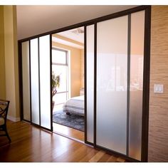 the sliding glass doors are open and ready to be used as a bedroom divider