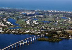 an aerial view of a bridge over water