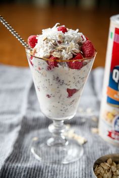 yogurt parfait in a glass with strawberries and granola on the side