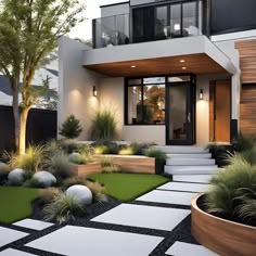 a modern house with grass and plants in the front yard